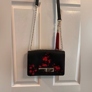 Women’s black leather enbroidered handbag